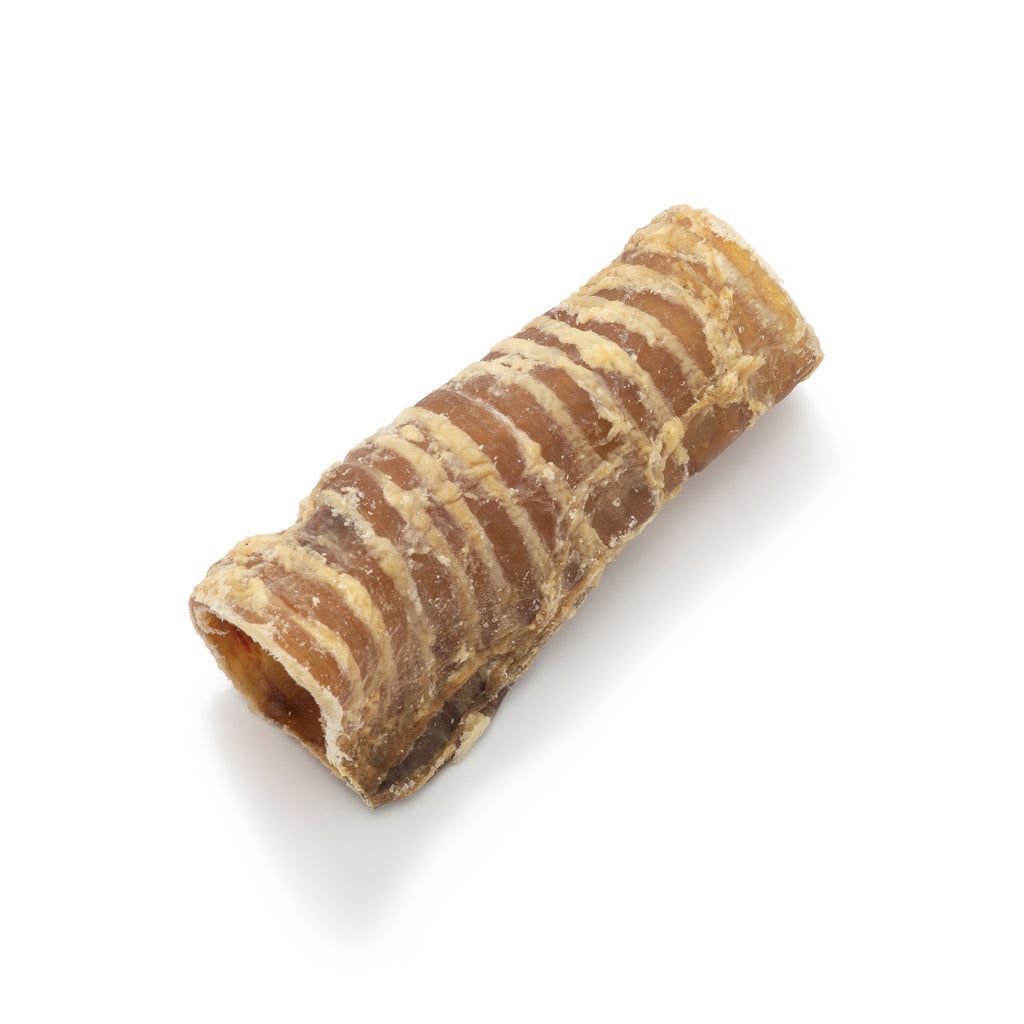 A striped pastry or cannoli on a white background