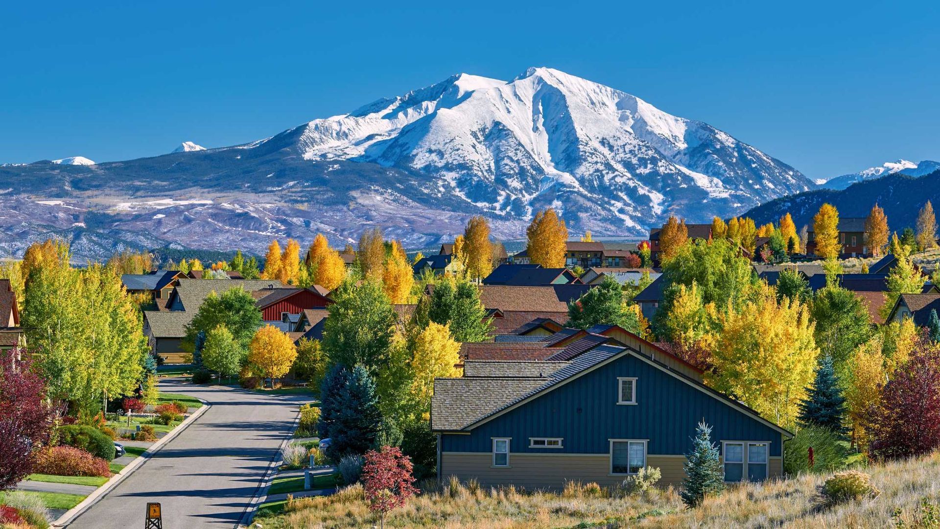 A residential area with a mountain in the background