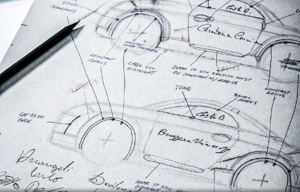 Architectural blueprint sketches with a black pen on top of the paper