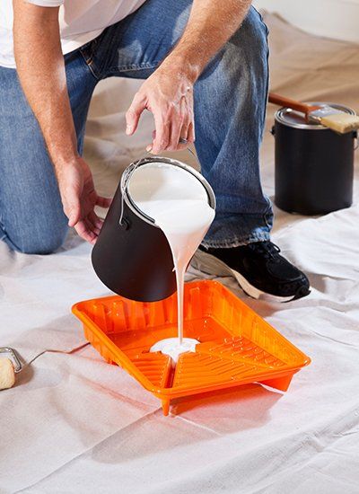 Painter Pouring Paint on the Tray | Finksburg, MD | Handyman On Call LLC Painter Pouring Paint on the Tray | Finksburg, MD | Handyman On Call LLC