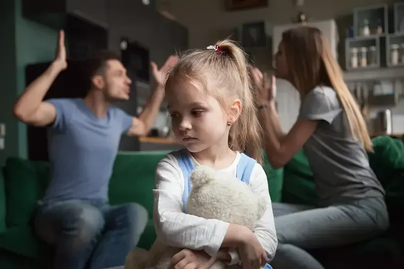 young girl with parents arguing about getting a divorce in new jersey