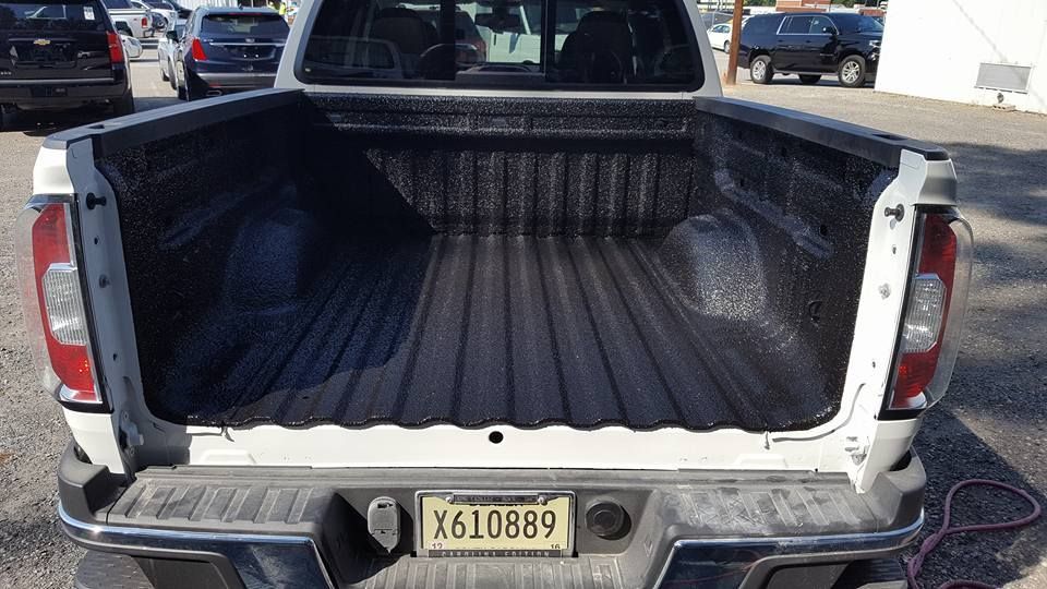 A white truck with a license plate that says x610889