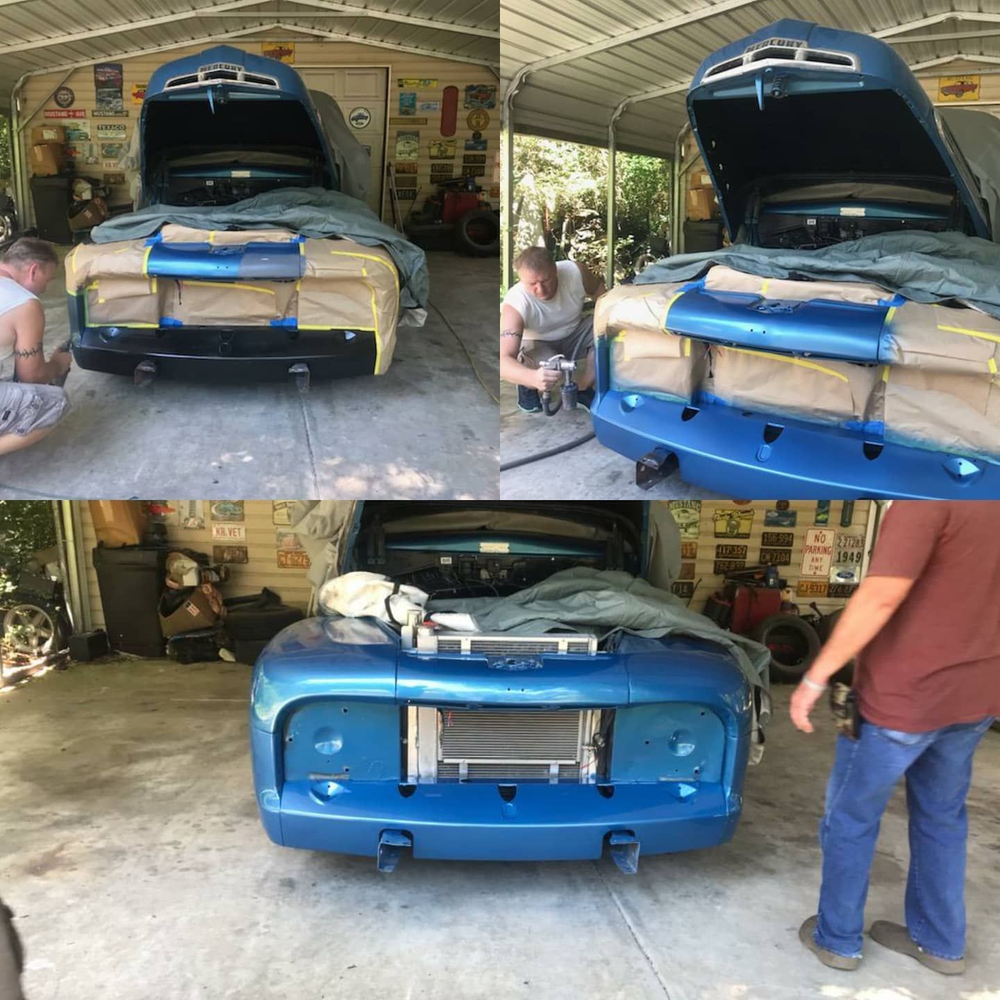 A blue car is being worked on in a garage