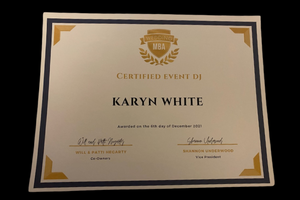 Framed certificate for Karyn White with gold accents on a dark background.