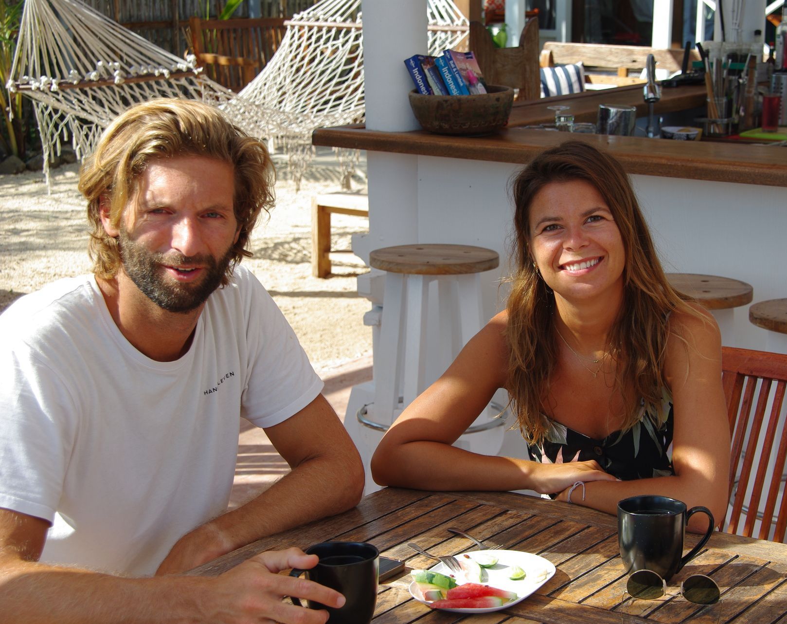 A man and a woman are sitting at a table