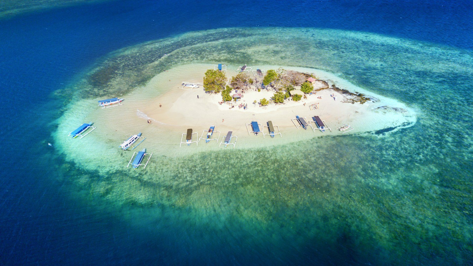 An aerial view of a small island in the middle of the ocean.