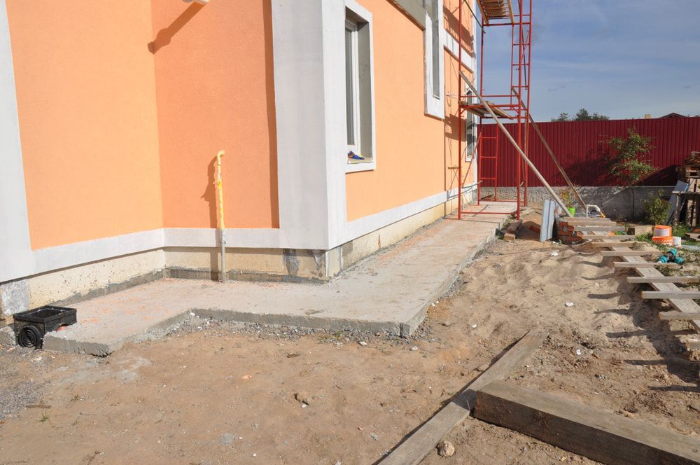 A Concrete Walkway Is Being Built in Front of A House Under Construction — Maslin Concrete Pumping in West Wyalong, NSW