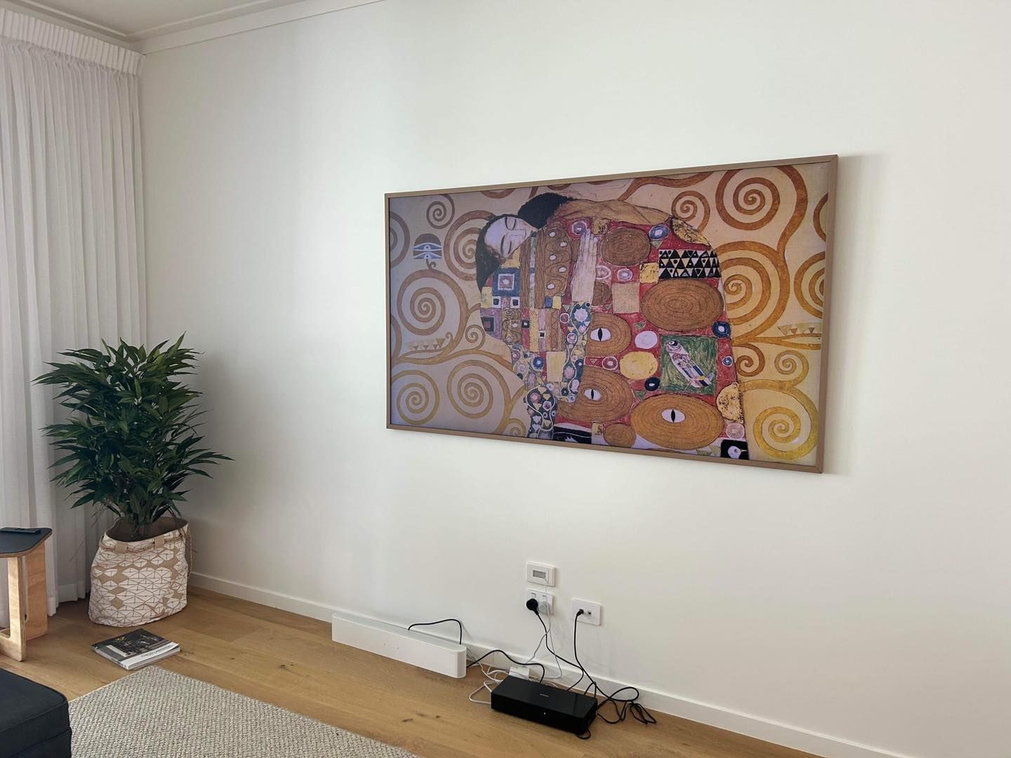 Gustav Klimt, the Kiss Hangs on a White Wall Above Visible Cables — OHMY Electrical Contractors in Carina, QLD