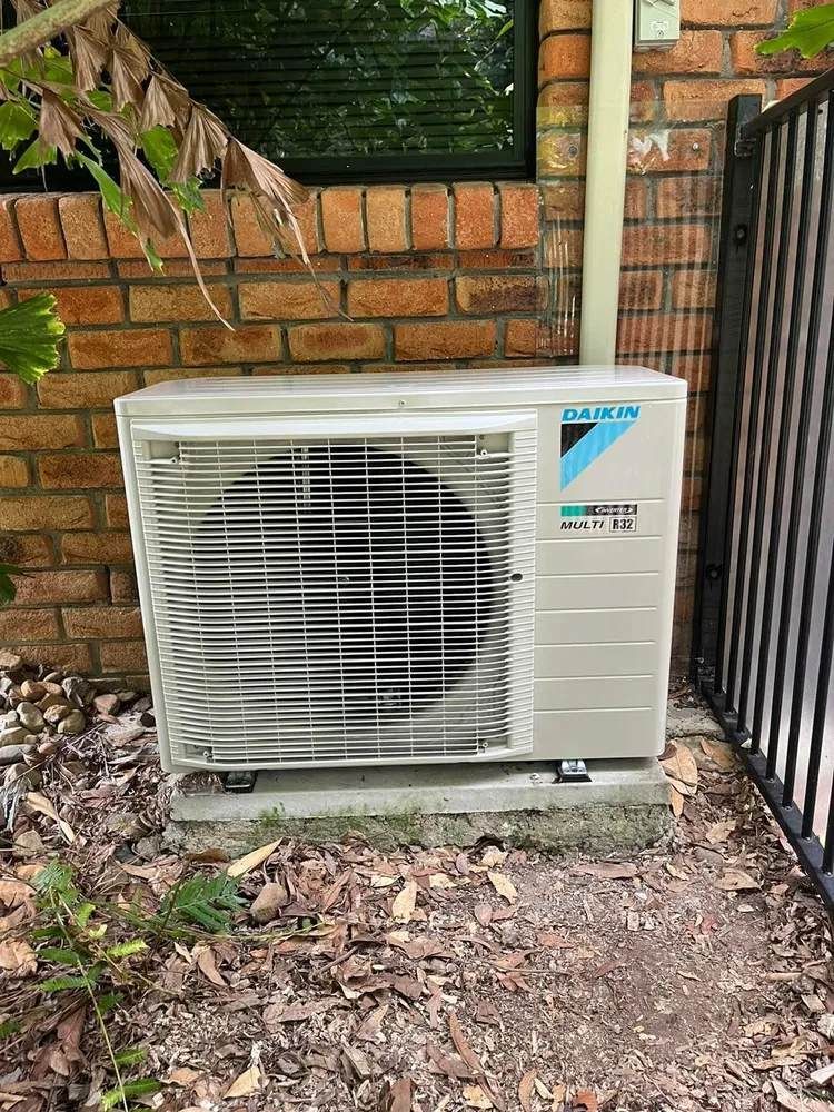 Air Conditioning In Carindale Outdoor Unit Beside Brick Wall