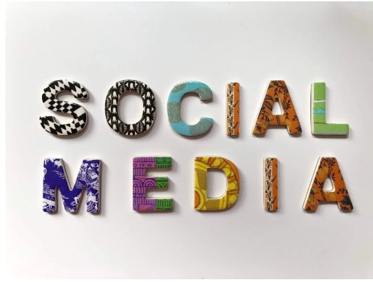 The word social media is spelled out in colorful letters