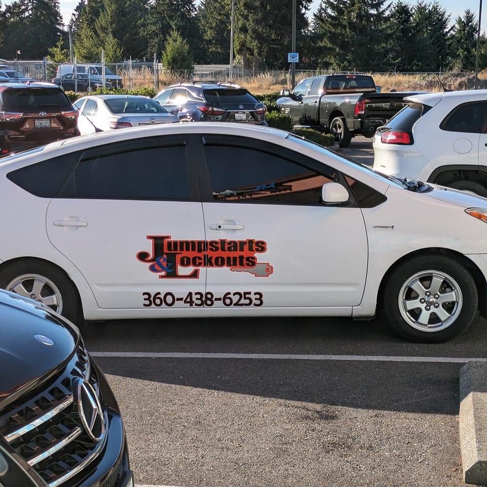 A man is looking through the window of a car.