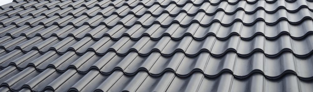 A Close Up of a Tiled Roof With a Pattern of Waves — Apex Roofing Group in Maclean, NSW