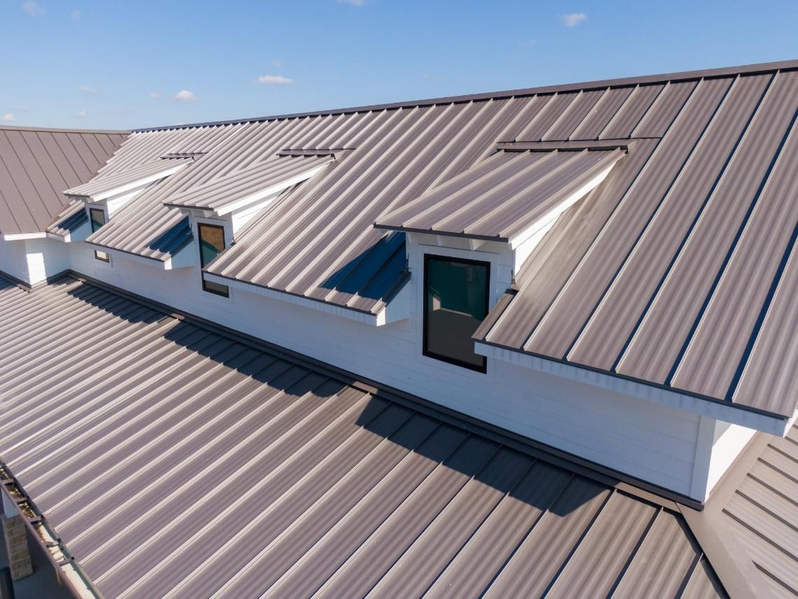 A Roof with A Lot of Windows on It — Apex Roofing Group in Banora Point, NSW