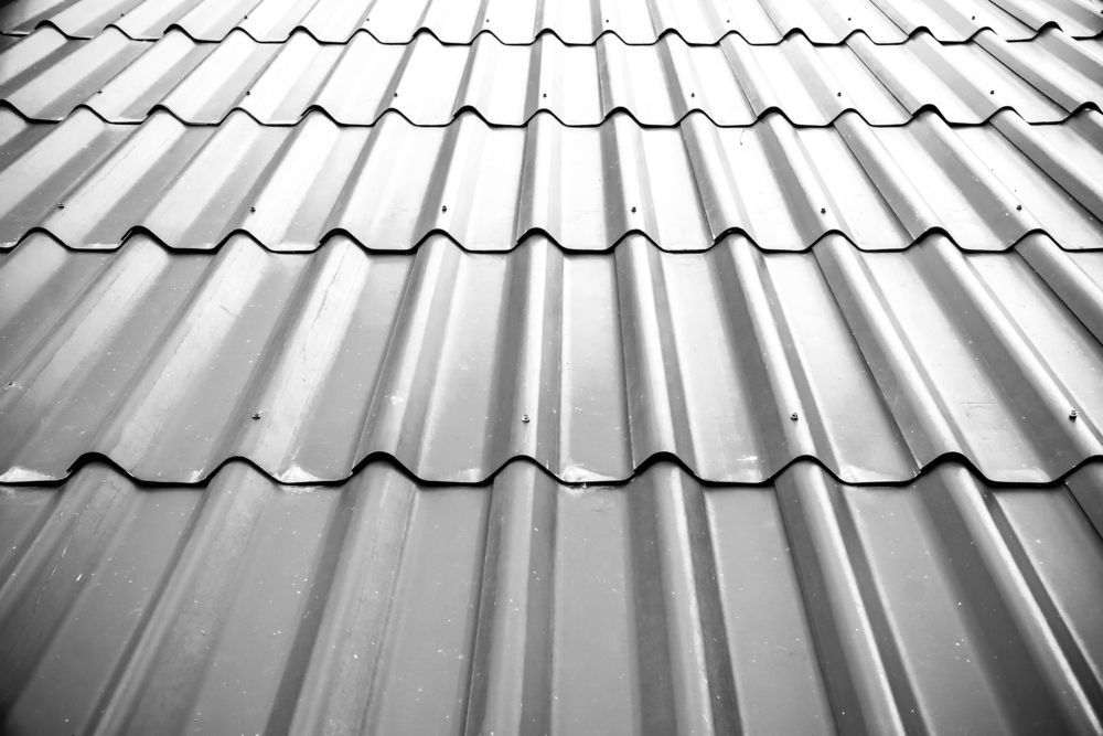 A Black and White Photo of a Metal Roof — Apex Roofing Group in Grafton, NSW