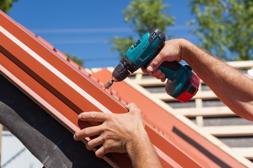 A Red Roof is Being Repaired — Apex Roofing Group in Mullumbimby, NSW