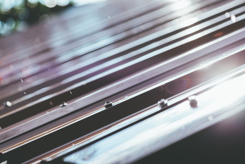 A Close Up of a Metal Railing on a Train Track — Apex Roofing Group in Kingscliff, NSW