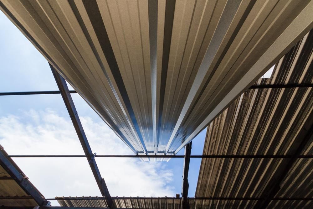 Looking up At the Sky Through a Metal Roof — Apex Roofing Group in Maclean, NSW
