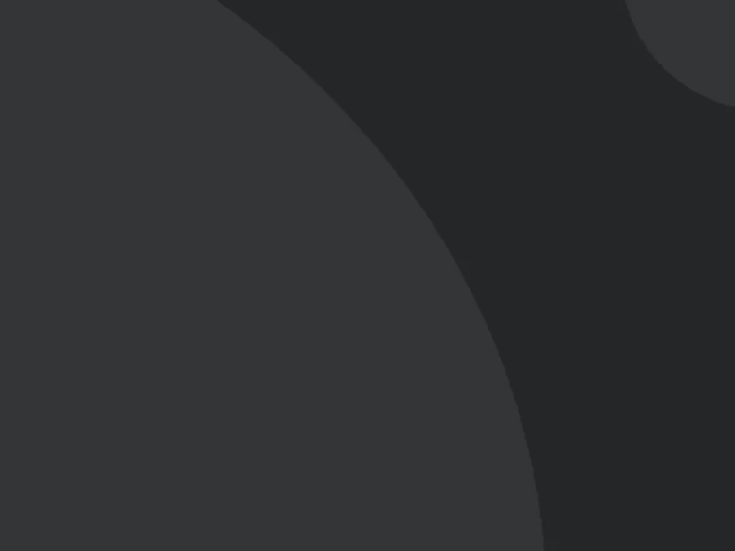 Dark gray abstract background with large curved shapes and a small circular corner accent