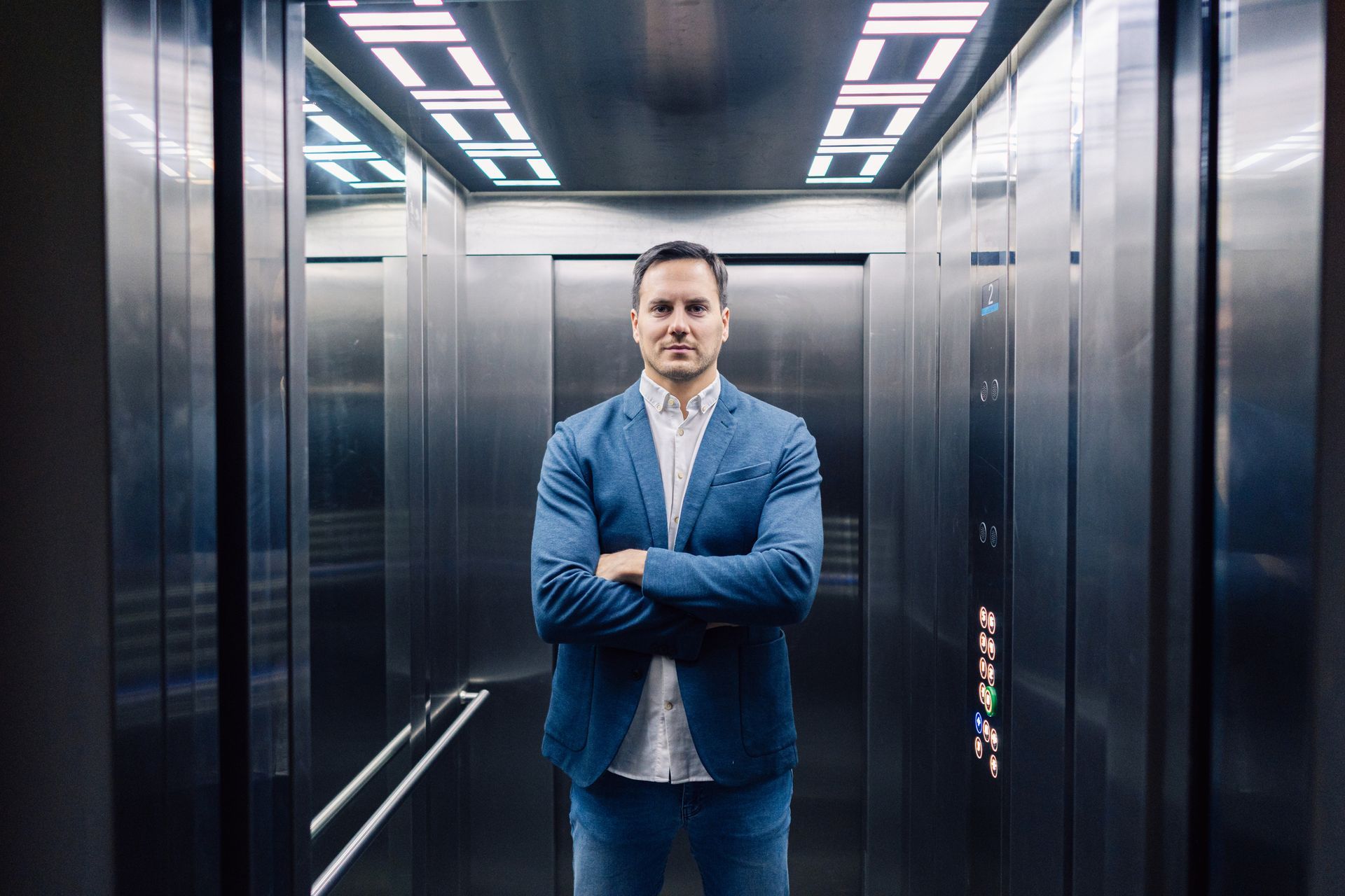 Young man in the residential elevator.