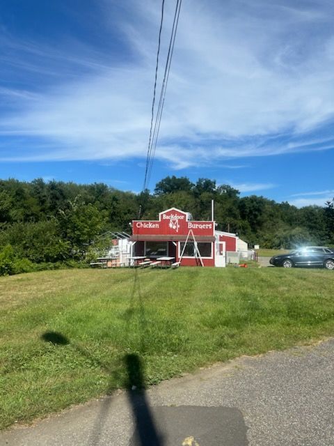 Red building with a sign for 