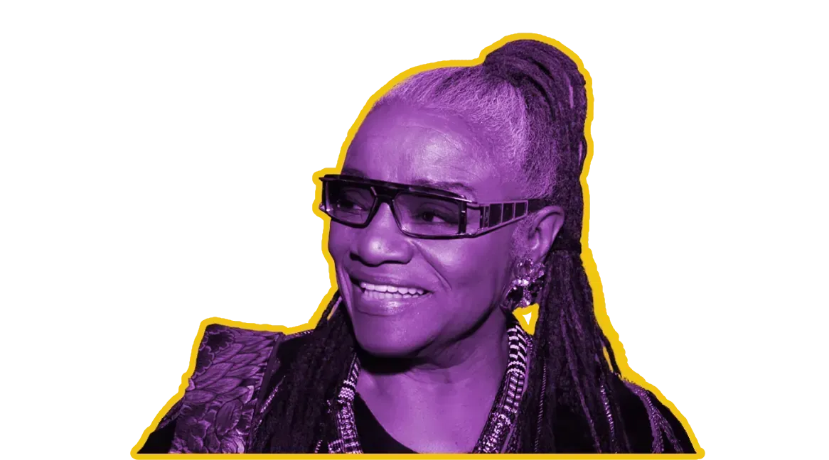 Woman with dark hair in a high ponytail and dark sunglasses, purple-toned image with a yellow outline.