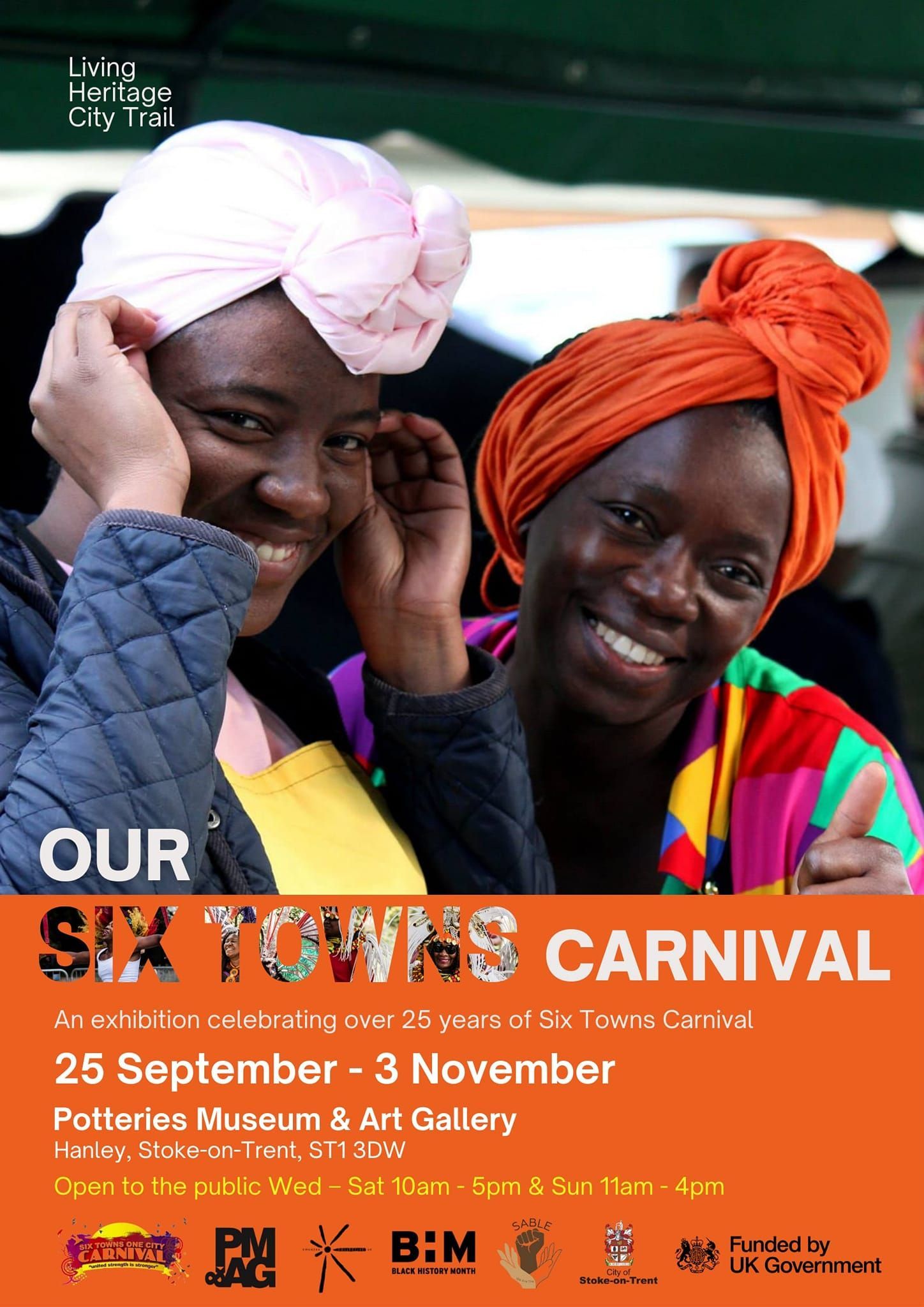 Two smiling Black women in headscarves, promoting the Six Towns Carnival: September 26-November 3.