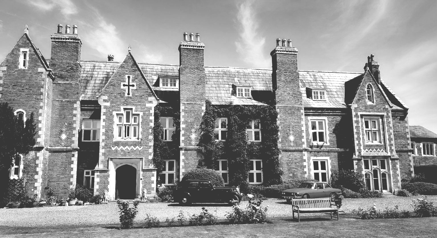 A black and white photo of a large brick building