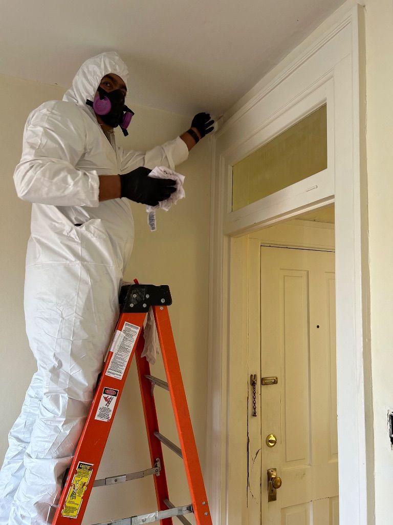 HRS Restoration Services specialist in protective suit handling meth cleanup in Denver Colorado