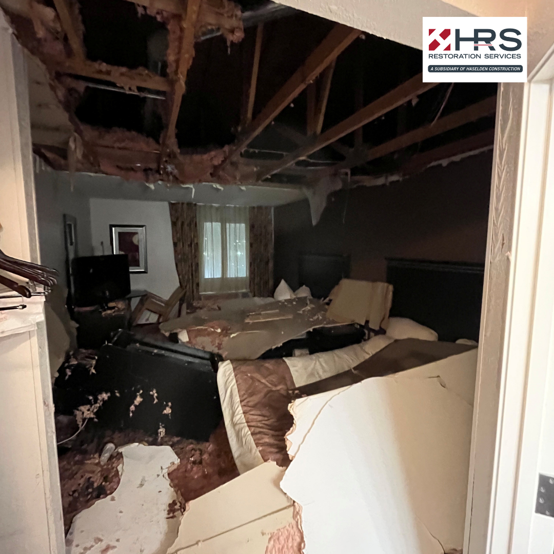 Bedroom with collapsed ceiling and severe water damage in Greenwood Village, CO