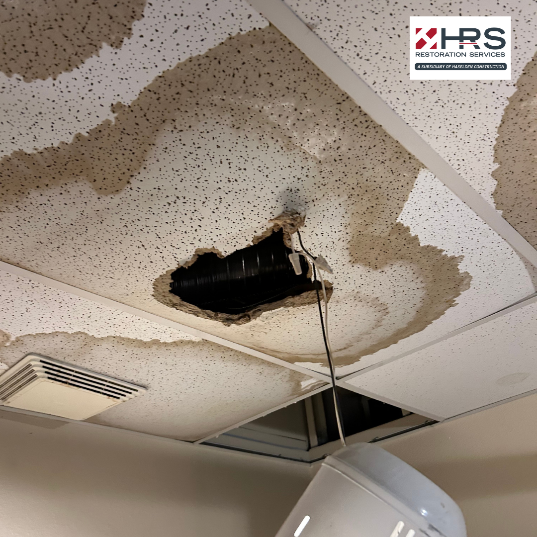 Commercial interior with ceiling leak and visible water damage in Greenwood Village, CO