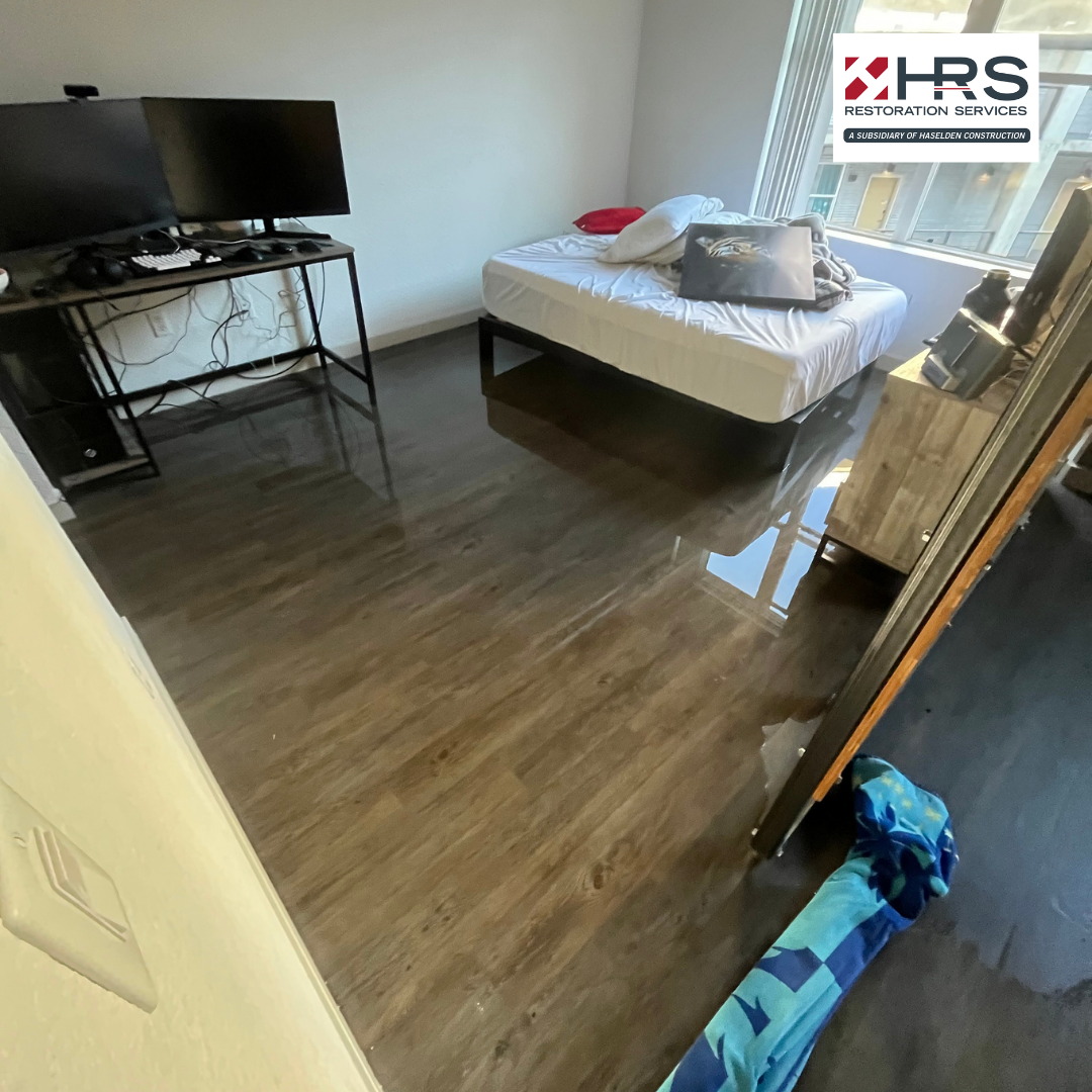 flooded bedroom interior after residential water damage in Parker, CO