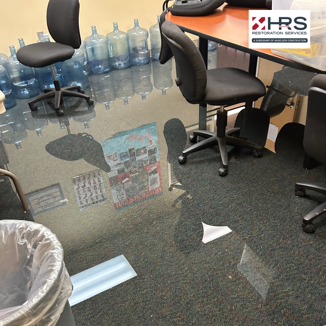standing water affecting office flooring after water damage in Parker, CO
