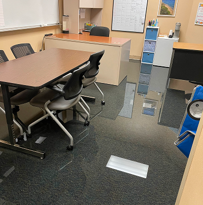 Flooded office requiring water damage restoration by HRS Restoration Services in Denver Colorado