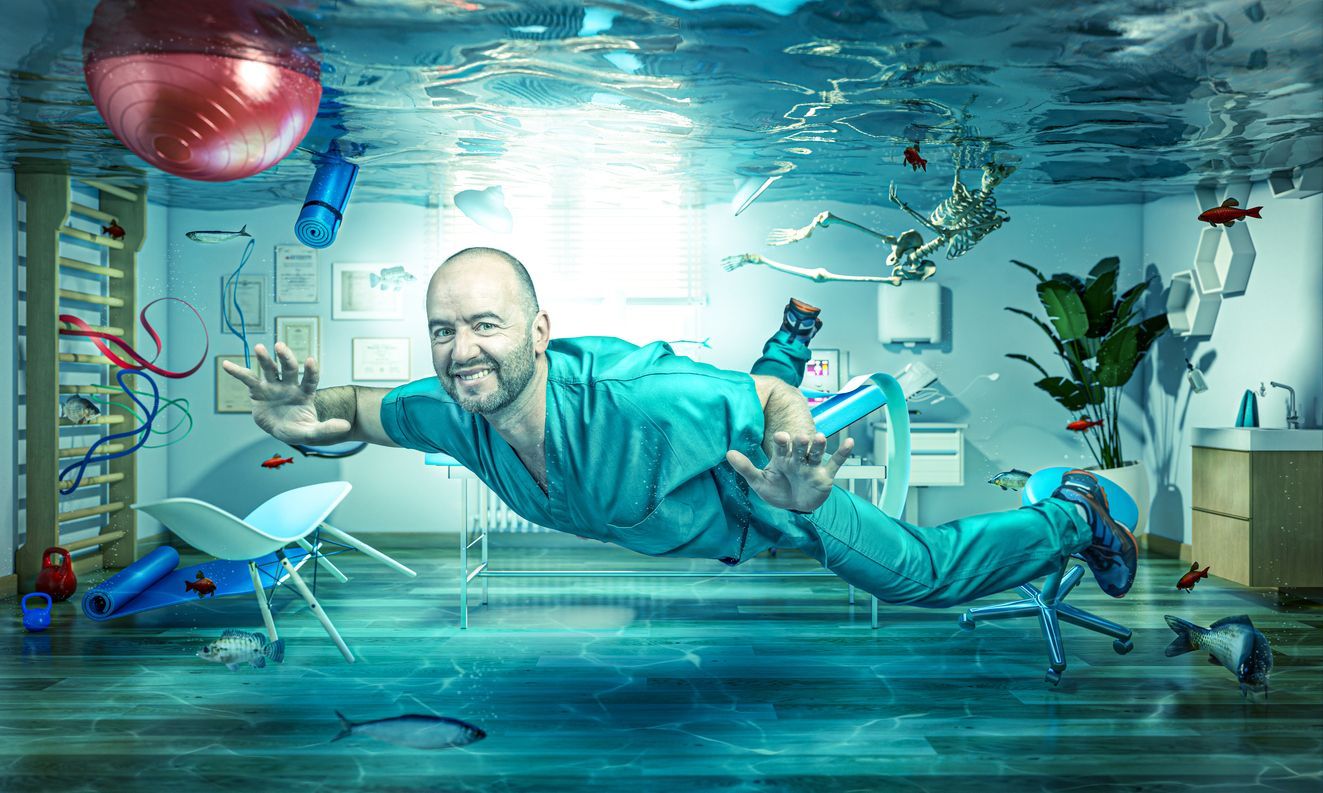 doctor floating in a hospital room submerged in water damage