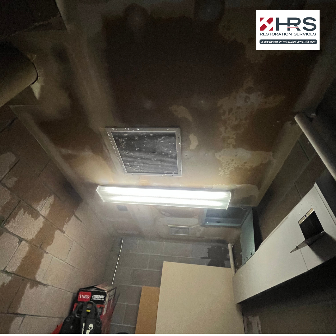 Utility room with ceiling leak and visible water damage in Greenwood Village, CO