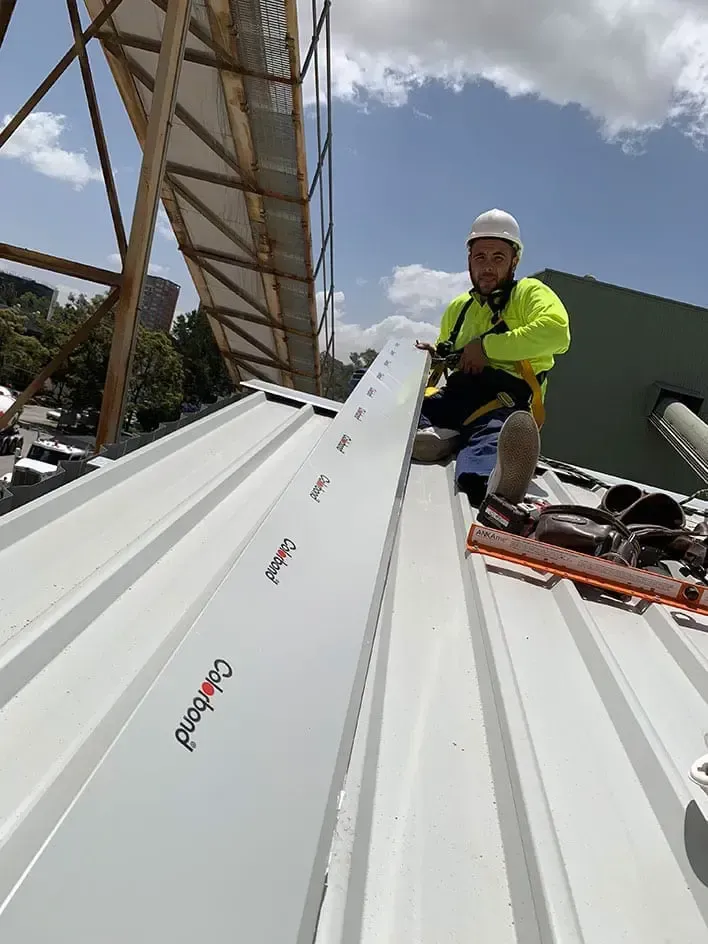 A Row of Sheds with A Blue Sky in The Background — ShedPro Constructions in Darawank, NSW