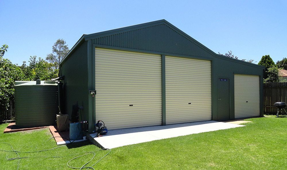 Residential Dark Green Double Door And Single Door Shed — ShedPro Constructions in Hunter Valley, NSW