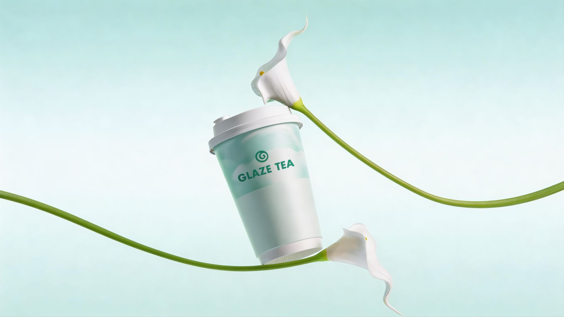 A white takeaway cup labeled "GLAZE TEA" suspended in the air, encircled by two white calla lily flowers against teal.