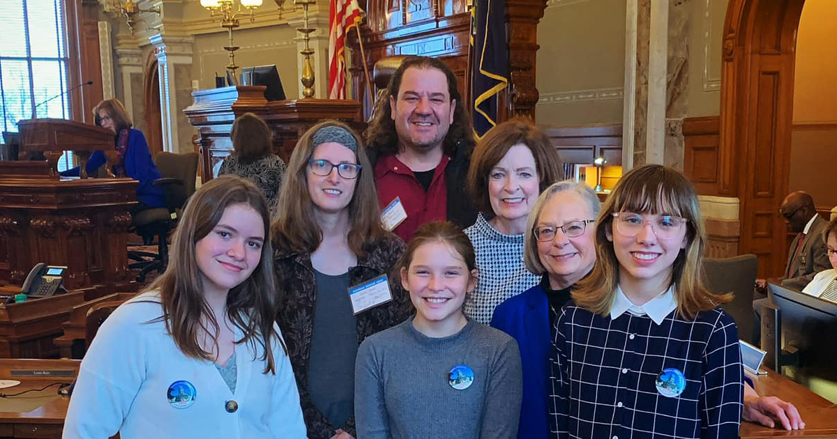 Pam Curtis on the House floor with Legislative Pages