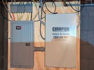 Wall-mounted electrical panels and wiring on a utility room wall.