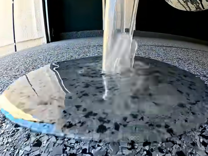 Epoxy Gloss Finish Resin being Poured on to Garage Floor