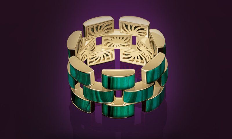 Fotografia Still de joias | TAG12 Uma pulseira de ouro e turquesa em um fundo roxo