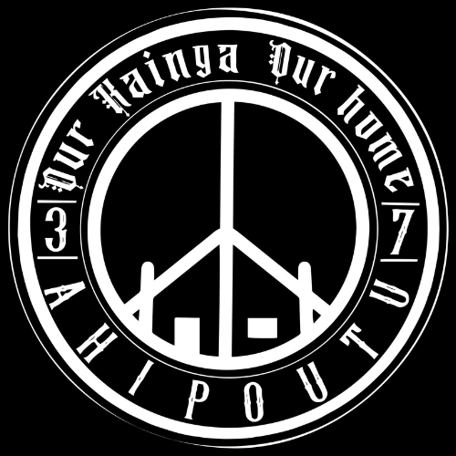 A peace sign in a circle with the words `` our home '' written around it.