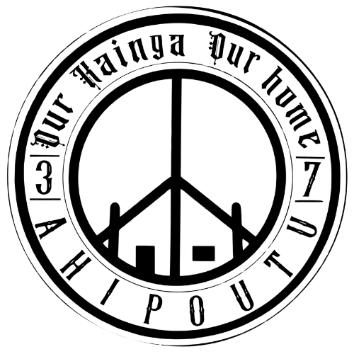 A black and white peace sign in a circle with the words `` our home '' written around it.