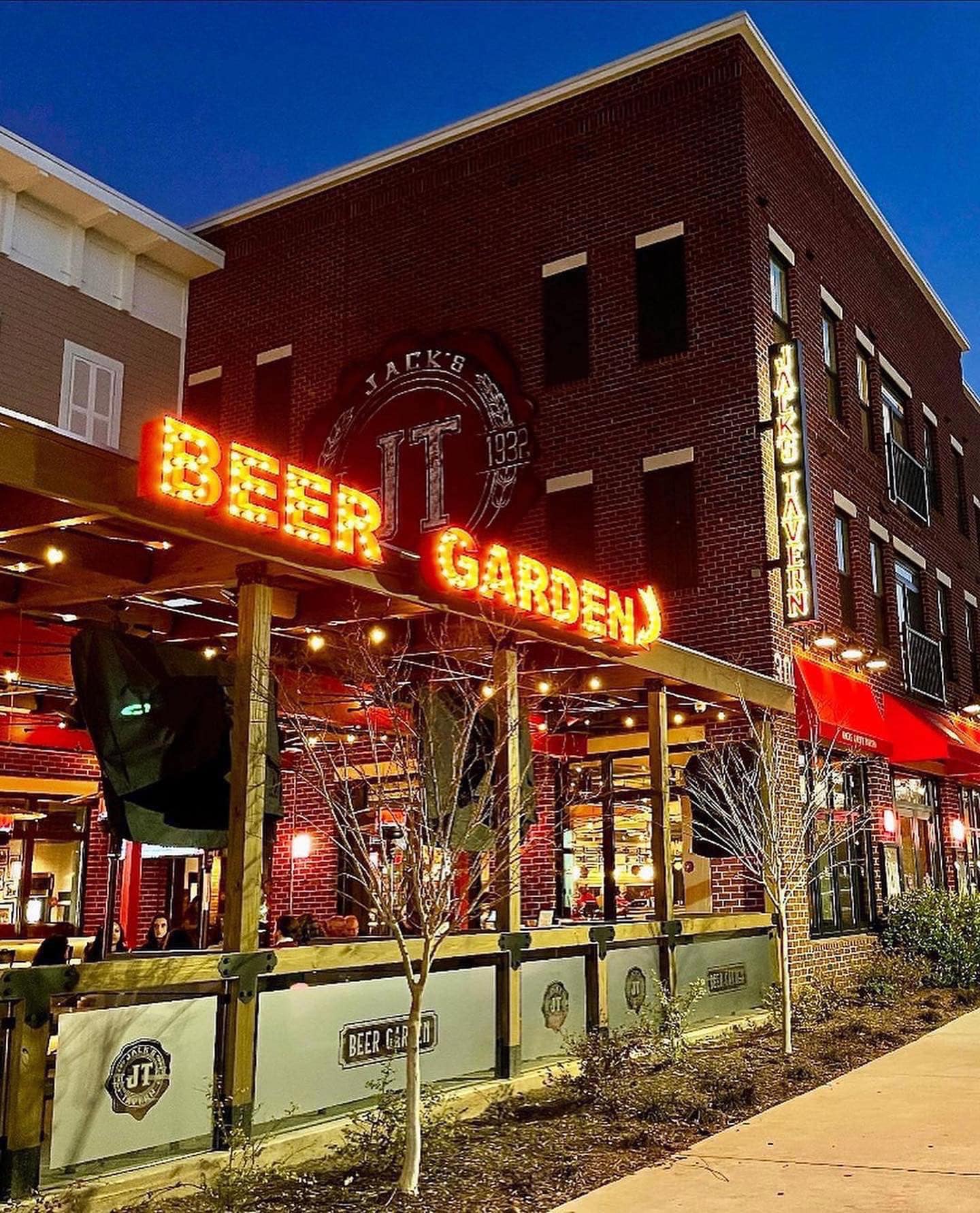 A large brick building with a sign that says beer garden