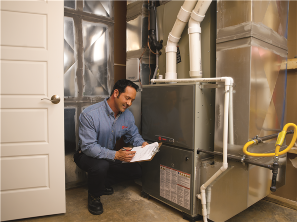 hvac technician inspecting a commercial hvac system - Ace Air Conditioning