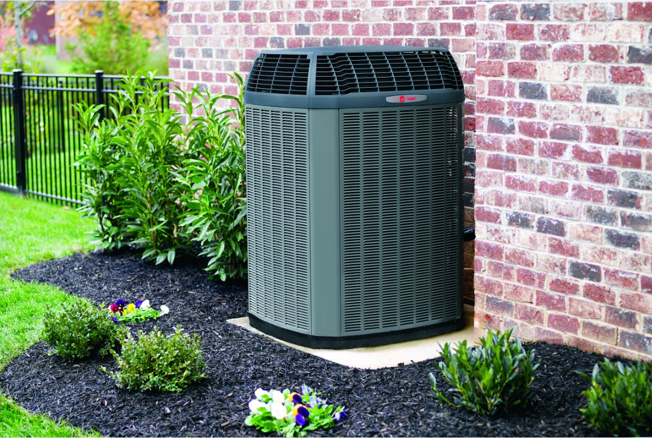 hvac technician inspecting an hvac system - Ace Air Conditioning