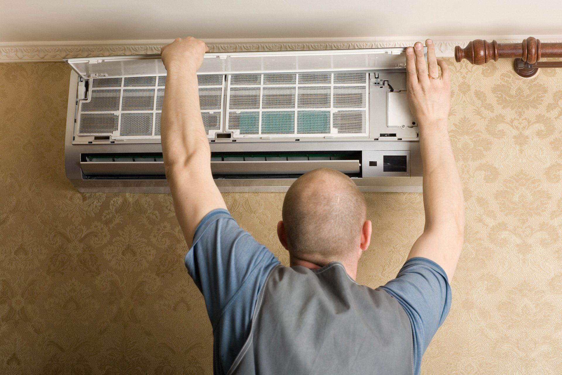 opening air conditioner unit to clean filters