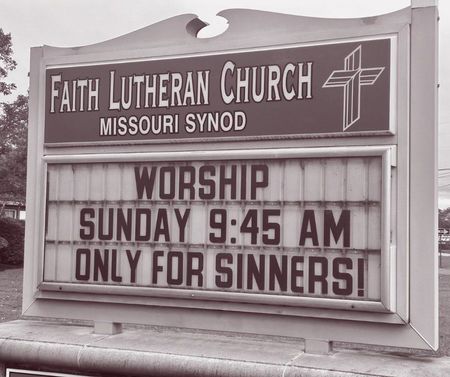 A church sign reads: 