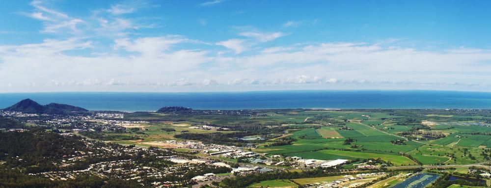 An Aerial View of a City and a River With Mountains in the Background — Express City Couriers In Smithfield, QLD